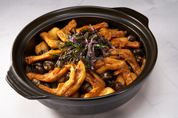A pot of delicious and fragrant screws, snails and duck feet in a pot