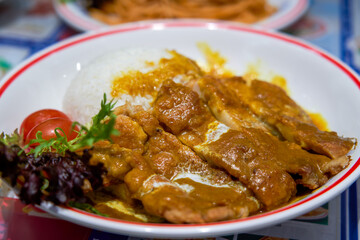 A delicious curry fried chicken chop rice in a Hong Kong tea restaurant