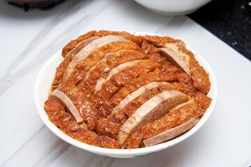 A bowl of fragrant and delicious traditional Chinese dishes, taro braised pork