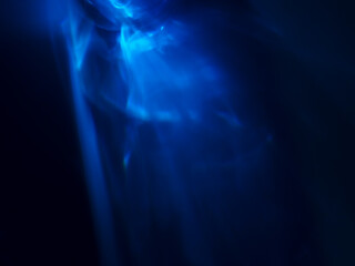 Blue light reflected in the dark for an energy minimalist abstract background.