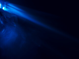 Blue light reflected in the dark for an energy minimalist abstract background.