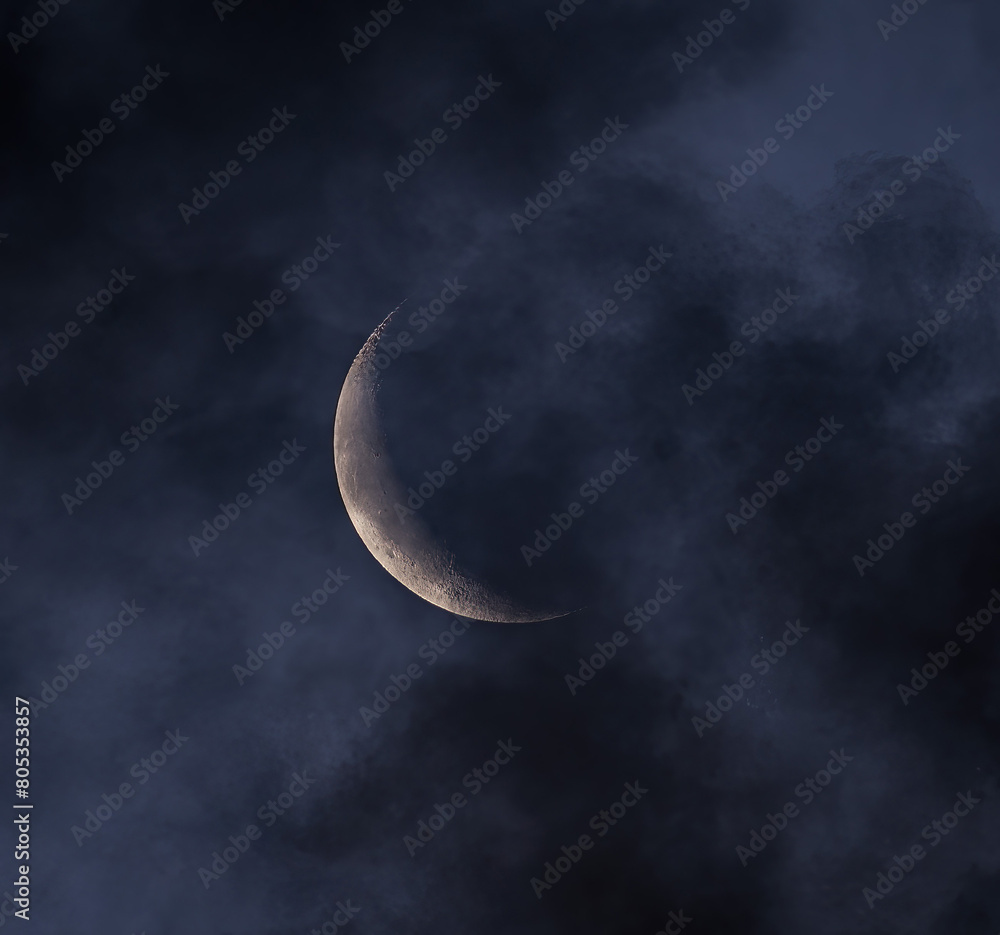 Wall mural waning crescent moon and clouds