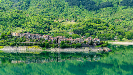 Fototapeta premium Panoramic view of Colle di Tora, beautiful village on the Turano Lake, in the province of Rieti, Lazio, Italy.