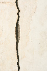 cracked and separated white cement or concrete wall surface background close-up, non standard...