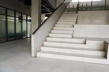 Empty stair way with railing handle isolated on horizontal ratio ceramic and stone office building...