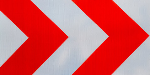 RED TRAFFIC ARROWS LEADING TO THE RIGHT 