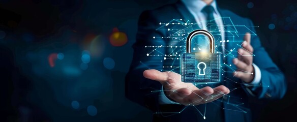 A businessman holding an abstract digital padlock on a dark blue background