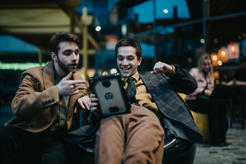 A group of professionals engage in a strategic discussion at a cafe, focusing on project development and problem-solving.