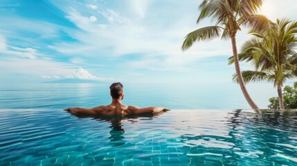 Luxury Resort. Man Relaxing In Infinity Swimming Pool Water. Beautiful Happy Healthy Male Model Enjoying Summer Travel Vacation At Tropical Spa Hotel In Indonesia, Sea View. Summertime Relax Concept