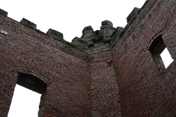 Rooftop crenellations above a brick wall on an abandoned home in Ohio