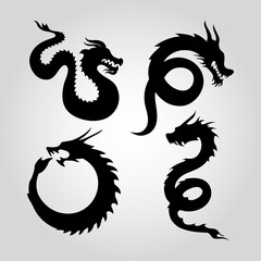 Set of vector silhouettes of dragons