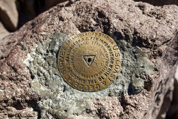 a peak bronze symbol of a geodetic survey at the lassen peak mountain, califronia 