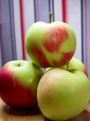 Fresh Apple Assortment. A selection of apples on a wooden surface, ideal for health and nutrition content.