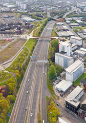 Pedestrian and cycling bridge over the M8 motorway in Glasgow viewed from above