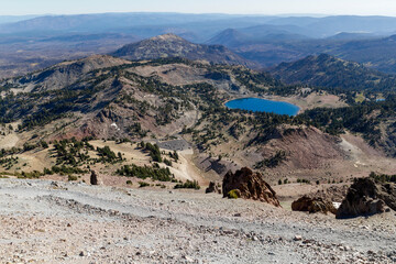 view from the lassen peak into the valley to the famous blue shining lake Helen in the national park, california