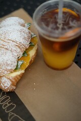 croissant and cold cocktail with orange