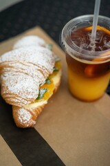 croissant and cold cocktail with orange