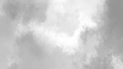 The abstract beauty of gray and black smoke swirling in an enigmatic and dim expanse

