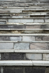 Vertical shot of an old destroyed concrete and stone steps of the stairs