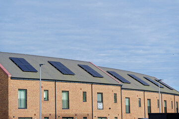 Solar panels installed on home roofs at new housing development