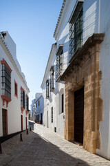 Casa Antigua del Ave Maria, typical Mediterranean architecture with whitewashed walls and narrow streets in the historical city of Carmona, province of Seville, Spain