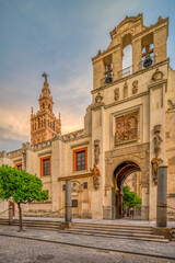 Obraz premium Puerta del Pedon (Door of Forgiveness) with the Giralda tower on the background, Seville, Spain
