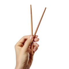 A woman's hand holds wooden chopsticks for sushi or rolls isolated on a transparent background 
