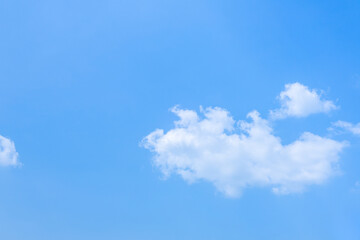 Beautiful blue sky and white fluffy group of clouds background in the morning skyline