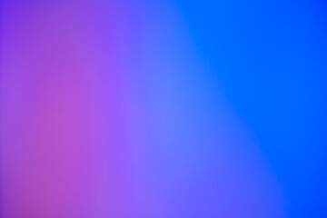 Abstract blurry background, with pink and dark blue colour shades. Smooth transitions of colors.