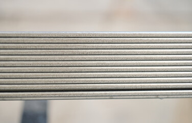 Metal steel roller shutter blinds stacked up on an industrial heavy duty racking in an industrial...