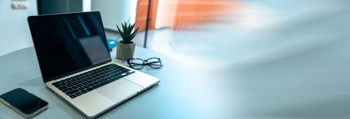 Office desk with laptop on it, glasses, decor, business concept, stock photo