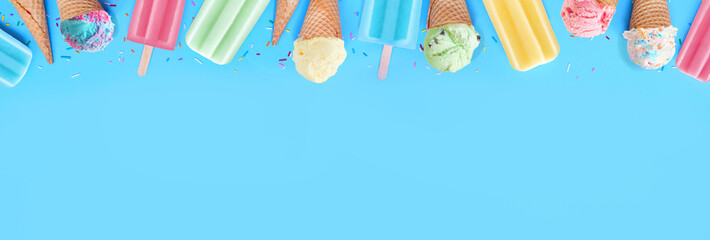 Selection of colorful pastel ice cream cones and popsicle summer frozen desserts. Above view top...