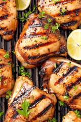 Grilled bone-in chicken thighs. Photograph for illustration of a culinary recipe.