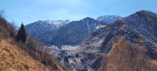 beautiful picturesque view high in the mountains, early spring, fallen covers,