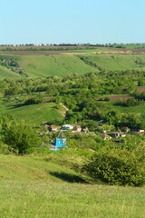 A small village in the middle of a green field