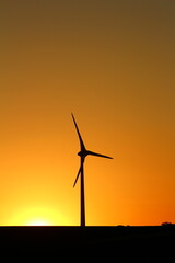A silhouette of a windmill