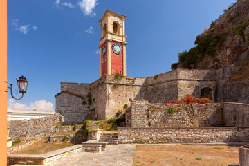 Clock tower and stone walls at Old Venetian Fortress in Kerkyra, Corfu, Greece, with steps