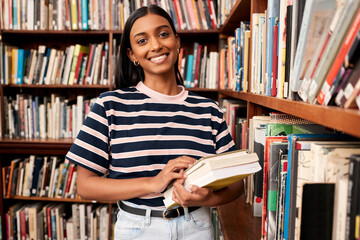 College, library and portrait of girl by bookshelf with smile for literature research, education...