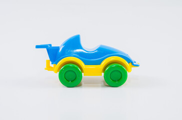 Plastic toy children's racing car on a white background.