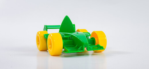 Plastic toy children's racing car on a white background.