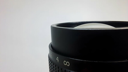 side view camera lens on white background