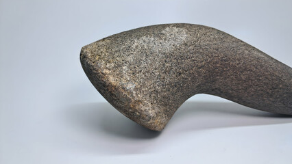 A pestle made from natural stone for grinding cooking spices