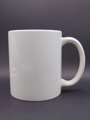 11oz white mug ceramic mockup for print on demand.;  blank plain background. The mug can be used to edit a mockup design on. left handed.