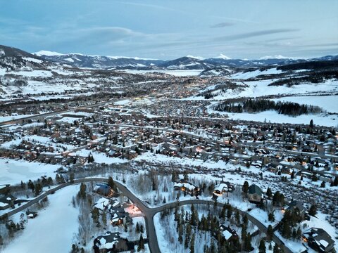 Silverthorne Colorado Winter Aerial, Snowy Mountain Town at Dusk