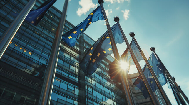 Bandiere dell'Unione Europea issate che si muovono al vento