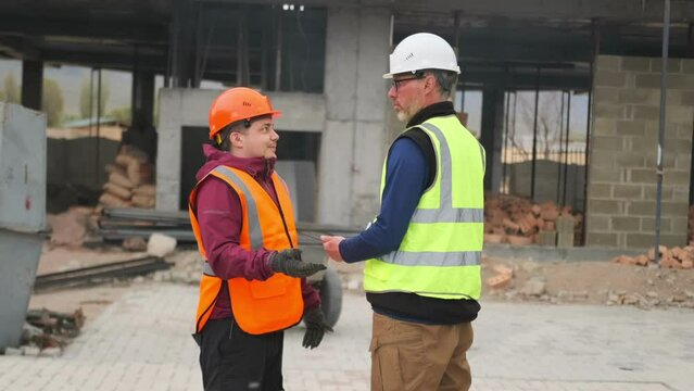 Supervisor, manager scolding employee for a mistake at construction site, dissatisfied quality work, safety violations.