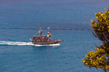 Tourist ship designed like pirate ship, sailing in sea waters near Corfu, Greece