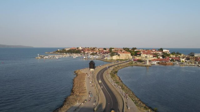 Bridge to Old Town of Nessebar, windmill and lanterns, road, landscape  Beautiful historical town Nessebar in Bulgaria. Drone view