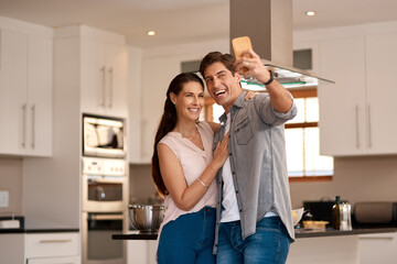 Couple hug, kitchen and selfie with smile for profile picture together, social media post and digital gallery. Home, woman and man for photo on mobile with embrace for happy memory, relax and love