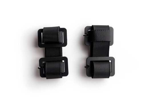 Black buckles on a clean white background, suitable for fashion or accessories concept
